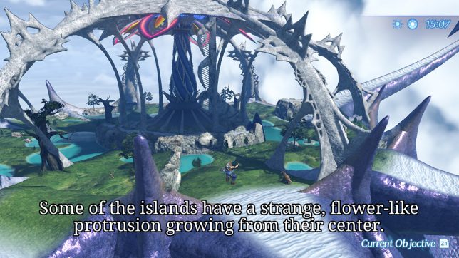 Image: A distant view of a large colorful feature extending upwards on an island.
Text: Some of the islands have a strange, flower-like protrusion growing from their center.